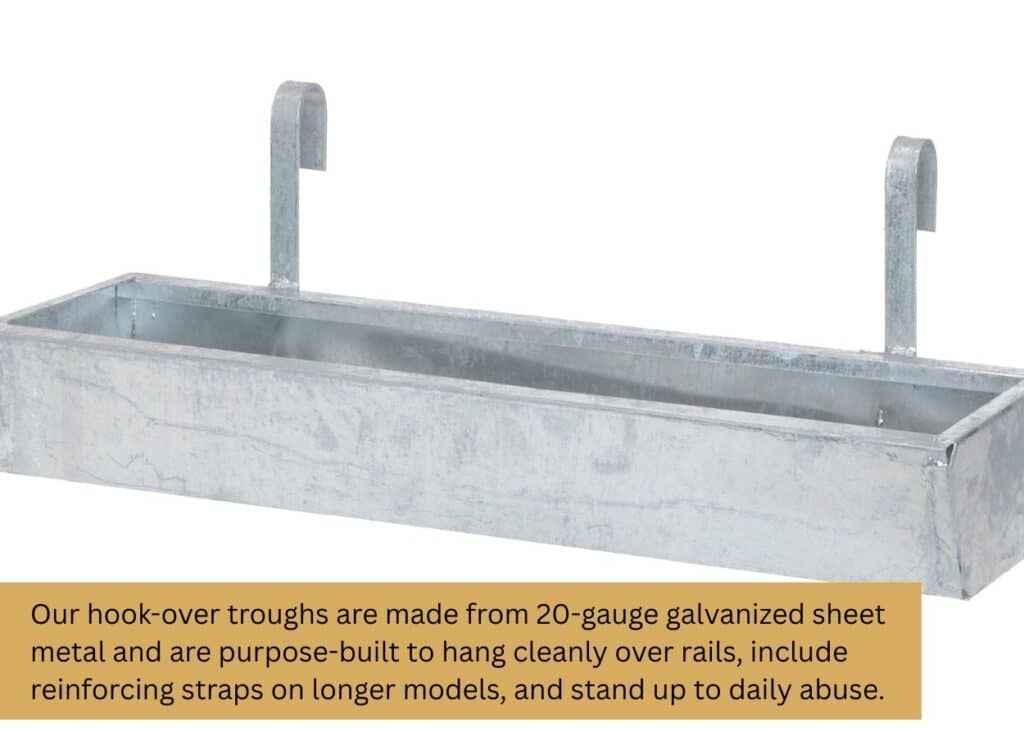 Metal hook-over feed trough for sheep and goats mounted on livestock fencing. Caption: Our hook-over troughs are made from 20-gauge galvanized sheet metal and are purpose-built to hang cleanly over rails, include reinforcing straps on longer models, and stand up to daily abuse.