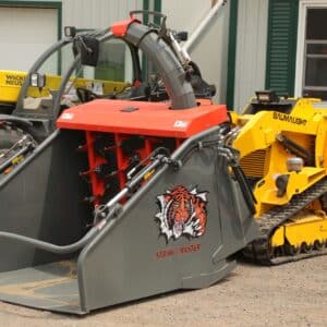 a mini skid steer has a smaller straw processor attached to it